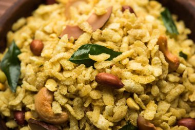 Jada Poha Namkeen Chivda / Thick Pohe Chiwda is a jar snack with a mix of sweet, salty and nuts flavours, served with tea. selective focus clipart