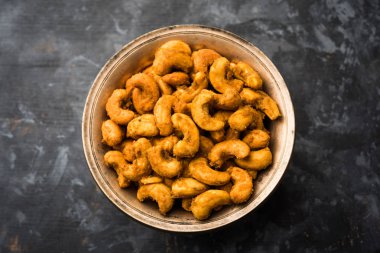 Kaju Pakoda/pakora OR Cashew Nut Fritters, is a tasty snack from India, served as Chakna clipart