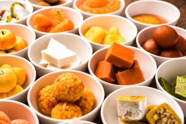 Rangoli of Assorted Indian sweets/mithai in bowl for Diwali or any other festivals, selective focus clipart