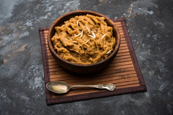 Wheat flour Halwa or Shira /  Atte ka Halva, Popular healthy dessert or breakfast menu from India. served in a bowl or plate. selective focus