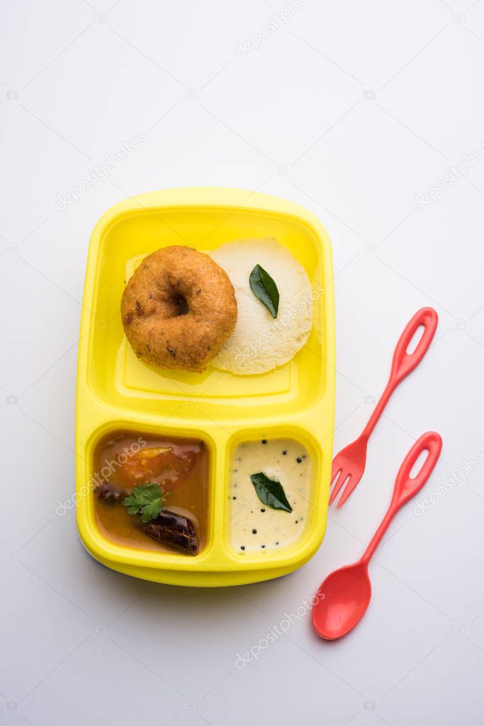 Idly / Idli with medu  Wada sambar in lunch box of tiffin