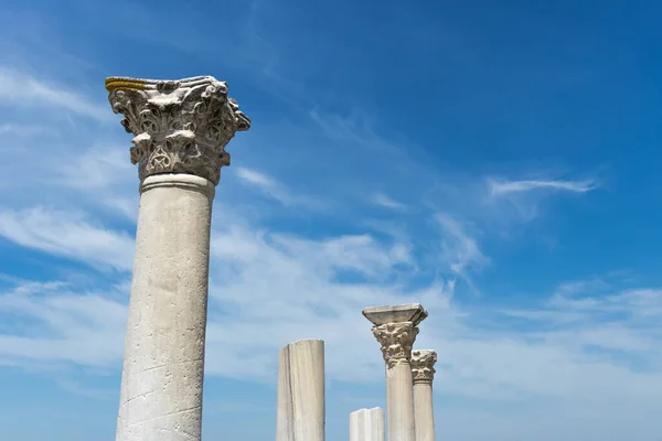 Several antique columns against the sky, the ruins of an ancient temple