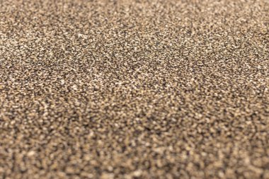 Motley kahverengi tüylü halı, doku. Sığ alan derinliğiyle odaklan.