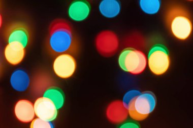 Çoklu renkli bokeh ışıklarının soyut arkaplanı çözüldü