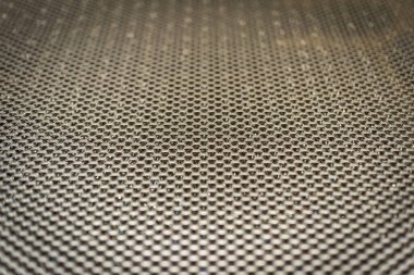 Metal şebekenin dokusu yakın plan. Sığ alan derinliğiyle odaklan.