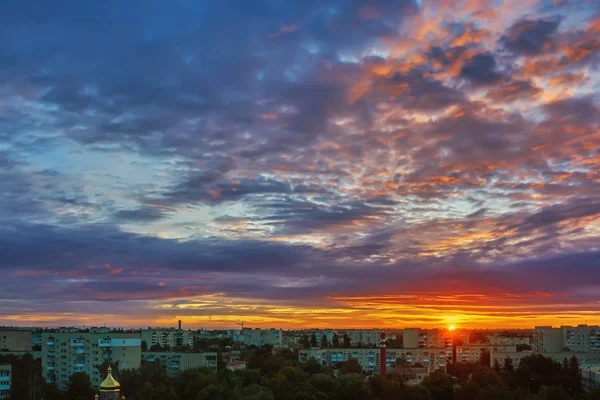 Sky with clouds over the city at sunrise.