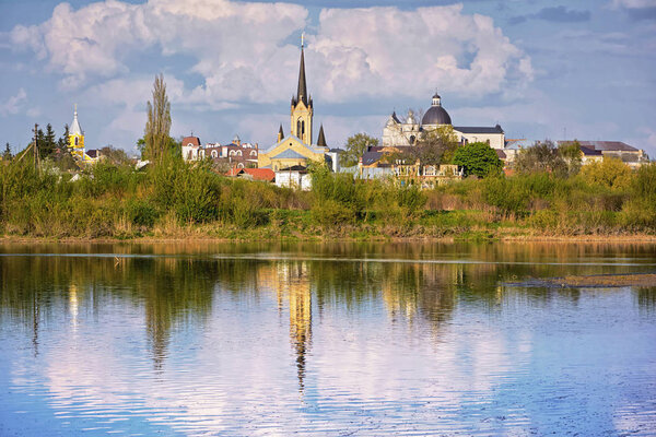 Landscape - churches and temples on the banks of the river (The city of Lutsk, Ukraine).