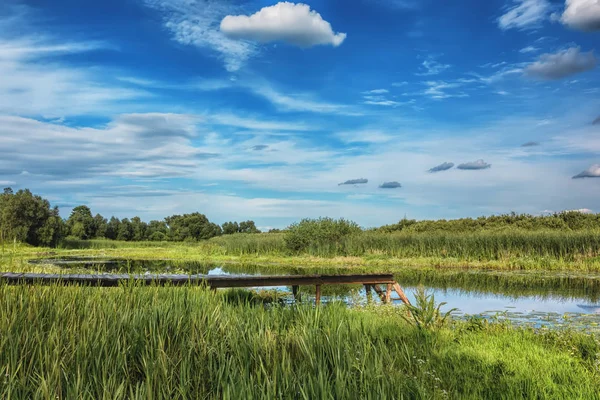 Sunny Day River Bank Wooden Pier Boats Blue Sky Clouds — Stock Photo, Image