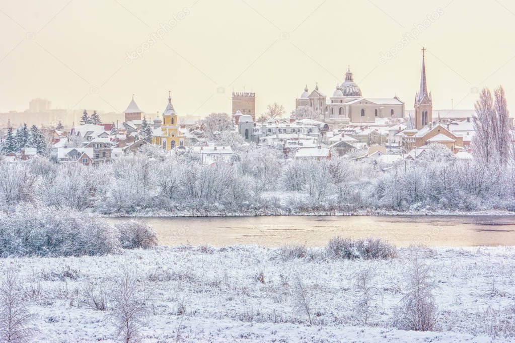 Winter landscape - churches and temples on the banks of the river (The city of Lutsk, Ukraine).