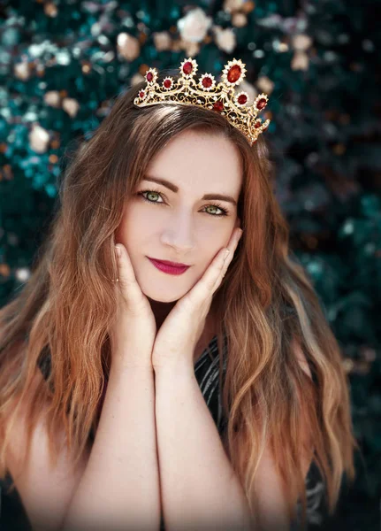 Young beautiful woman in crown   posing