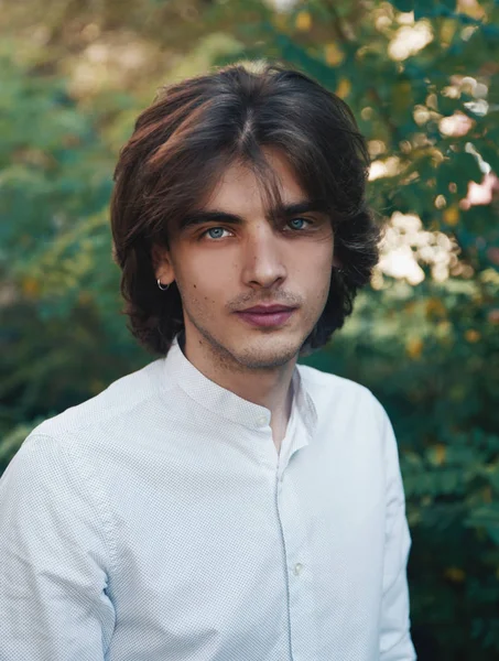 stock image Portrait of young  handsome man posing in park 