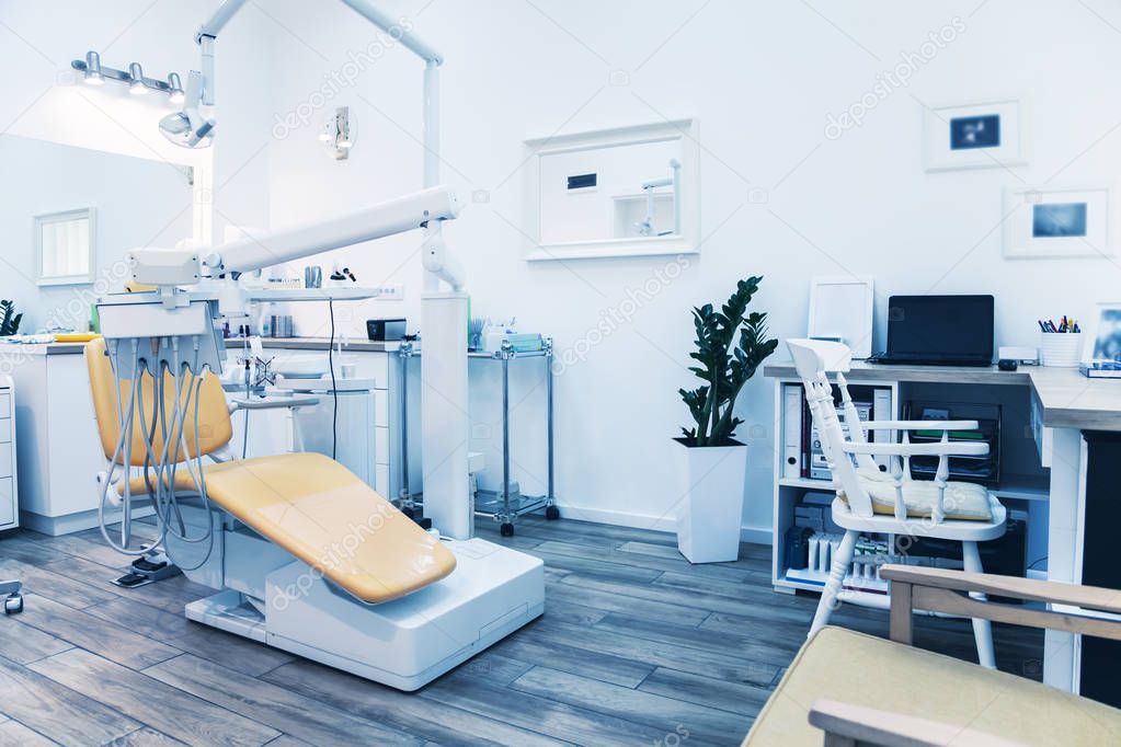 Special equipment for a dentist. Modern dentist's chair in a medical room.