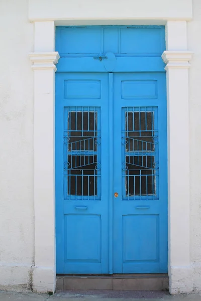 Old Fashioned Blue Wooden Front Door Metal Grates White Stone — Stock Photo, Image