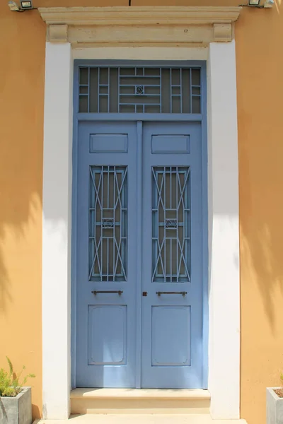 Retro Style Blue Wooden Front Door Metal Grates Yellow Stone — Stock Photo, Image