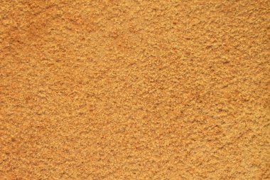 Pürüzlü dokulu sarı taş duvarın yüzeyi 