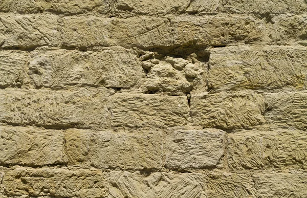 Güneş Işığında Kaba Taş Tuğla Bir Dış Bej Duvar Parçası — Stok fotoğraf