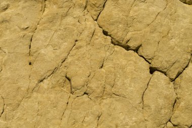 Kuru çatlamış düz sarı dağ kaya arka plan