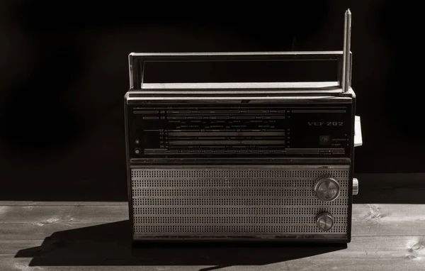 Old radio on a black background