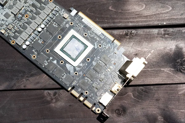 Computer graphics card board on wooden background