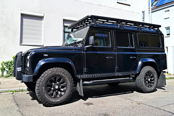 Neu-Ulm, Germany - September, 6, 2025: Land Rover Defender 110 parking at the roadside.
