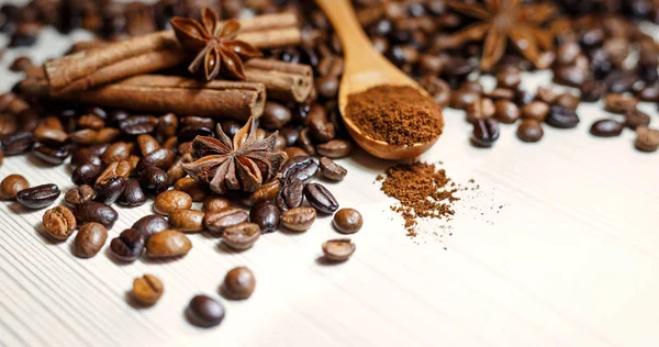 Coffee and spices on a light wooden table