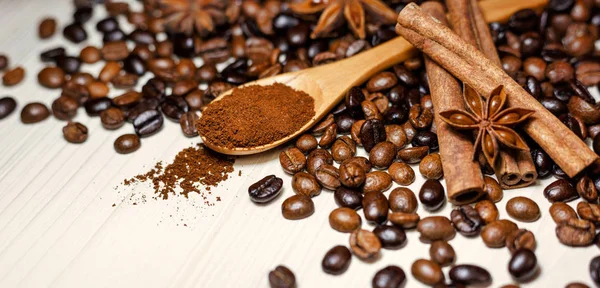 Coffee and spices on a light wooden table