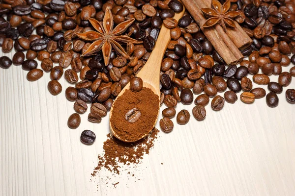 Coffee and spices on a light wooden table