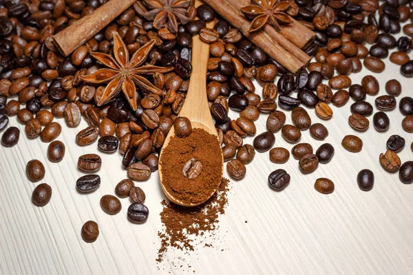 Coffee and spices on a light wooden table