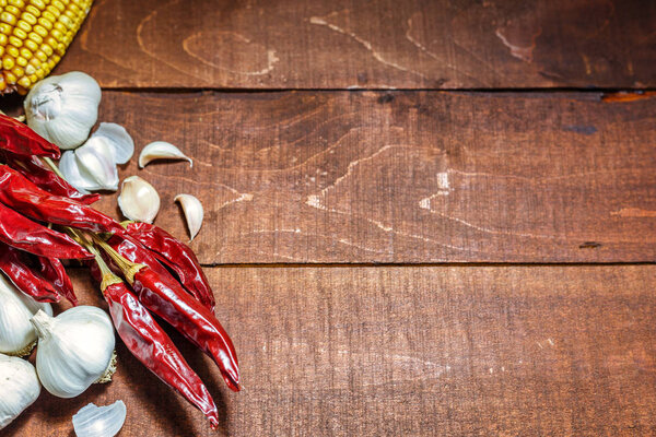 Hot spices on a wooden background