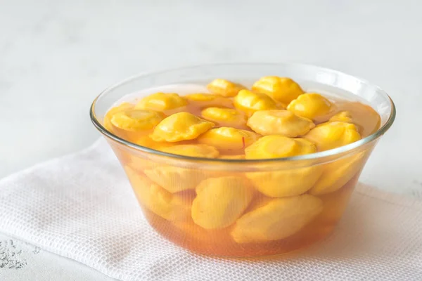 Bowl of pattypan squash in a glass bowl