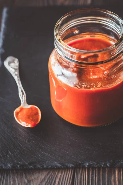 Barbecue sauce in the glass jar — Stock Photo, Image