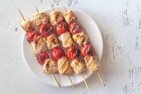 Grilled chicken skewers on the white plate — Stock Photo, Image