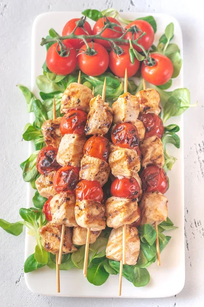 Grilled chicken skewers on the white plate — Stock Photo, Image