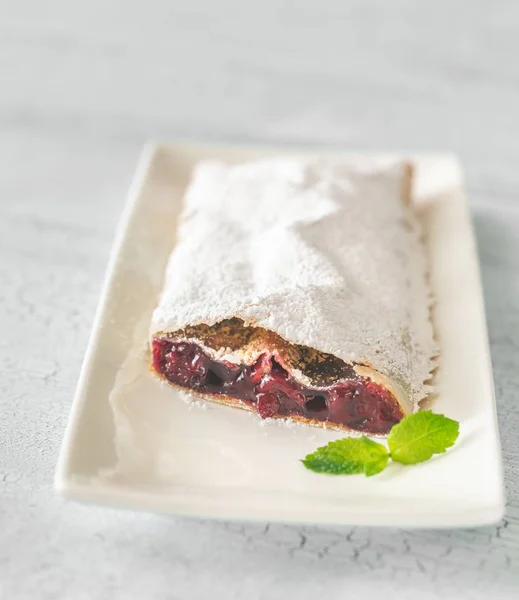 Cherry strudel on the white plate — Stock Photo, Image