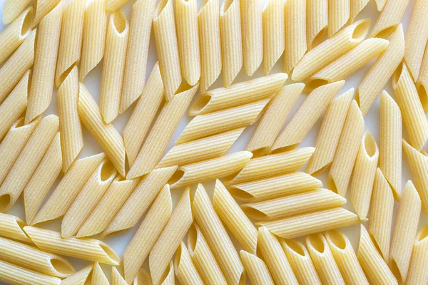 Raw penne pasta — Stock Photo, Image