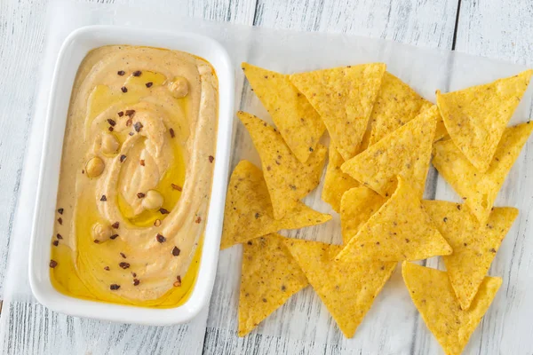 Bowl of hummus on the wooden table — Stock Photo, Image