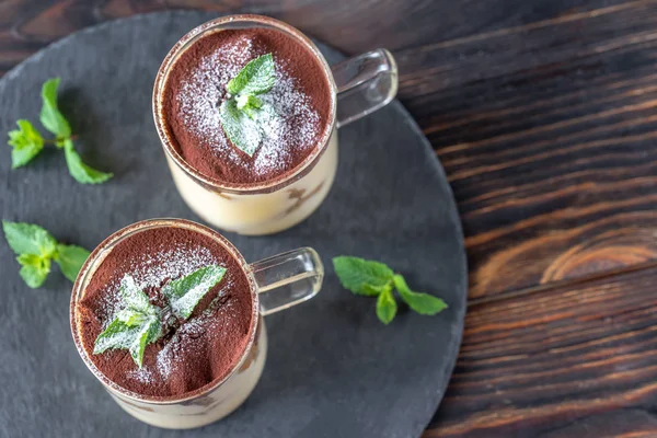 Two glass mugs of tiramisu — Stock Photo, Image