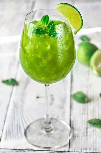 Glass of green mojito — Stock Photo, Image