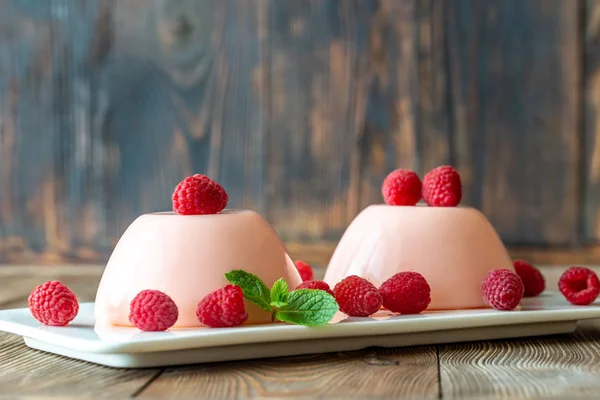 Dessert puddings with raspberries — Stock Photo, Image