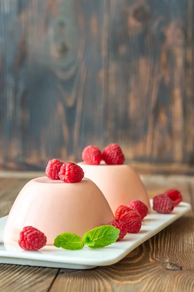 Dessert puddings with raspberries — Stock Photo, Image
