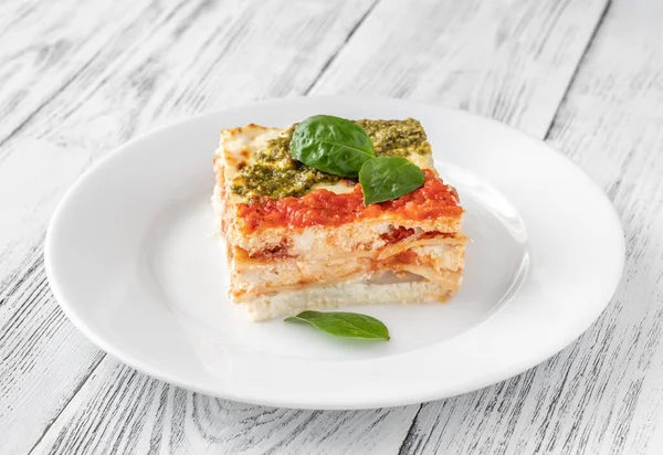 Portion Ricotta Lasagne Topped Tomato Sauce Pesto — Stock Photo, Image