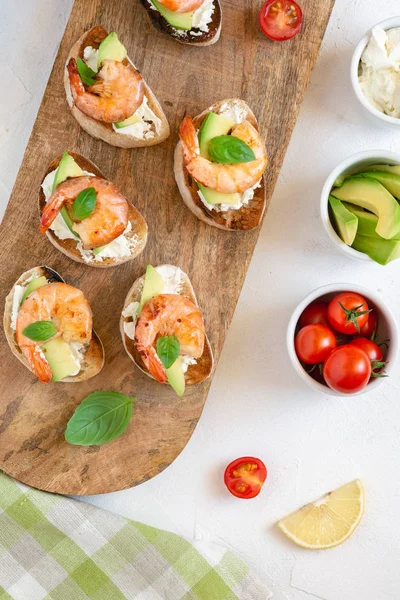 Bruschetta Italian Snack Sandwiches Shrimps Avocado Cheese Decorated Basil — Stock Photo, Image