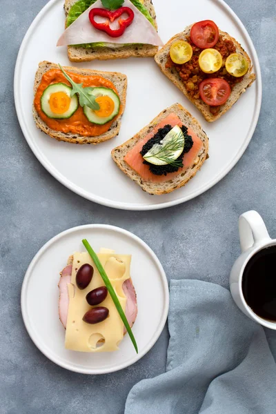 Breakfast toasts with various toppings. Healthy bruschetta. Bread sandwich.