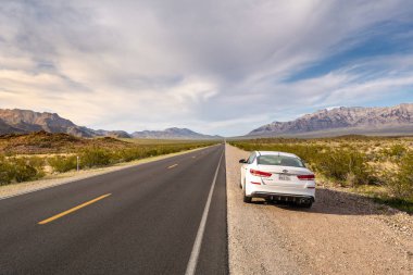 CALIFORNIA, USA - April 4, 2019: White KIA Optima parked on the roadside in California clipart