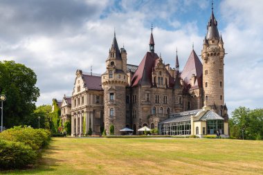 MOSZNA, POLAND - July 16, 2019: The Moszna Castle in southwestern Poland, one of the most magnificent castles in the world from 17th century. clipart