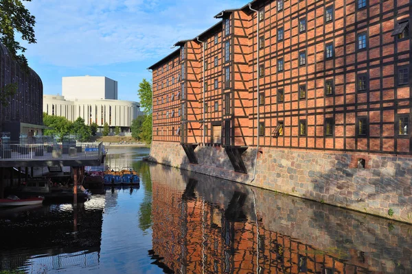 Bydgoszcz, Poland - August 15, 2019: Rother's Mills on Mlynska island in historic part of Bydgoszcz, Opera Nova building in the background Stock Image
