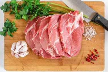 Raw pork neck meat cuts with spices clipart