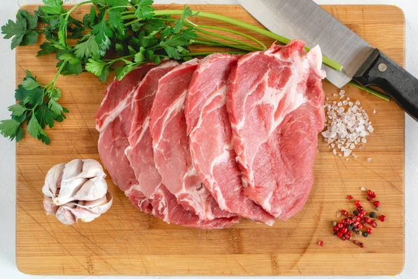 Raw pork neck meat cuts with spices