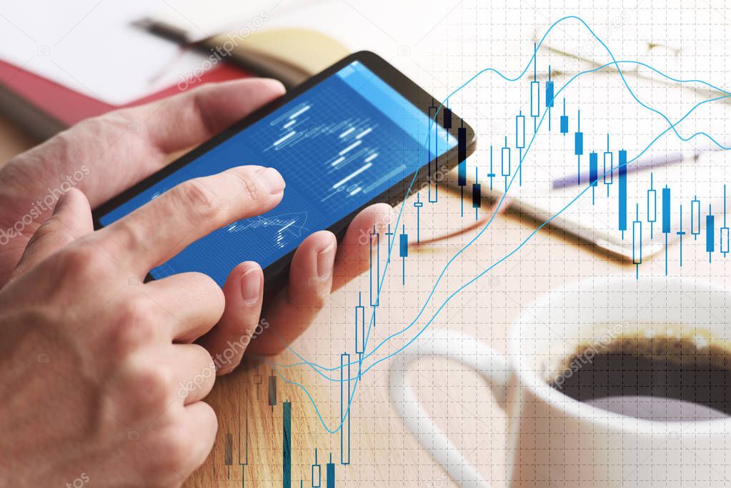 Stock market charts on smartphone screen.
