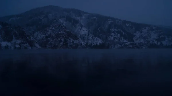 night landscape river and mountains behind the river